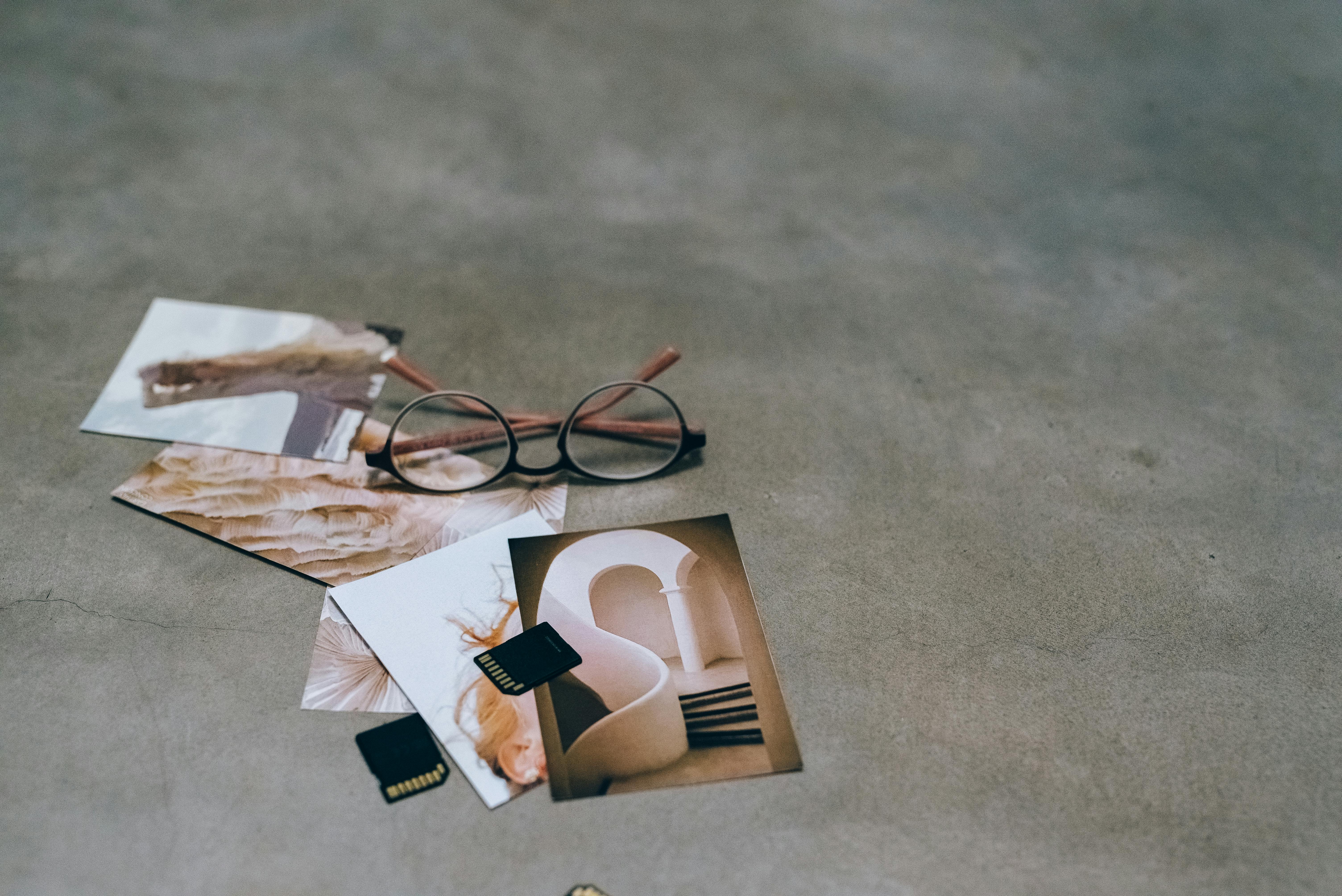 Minimalist display of handcrafted eyewear frames on a concrete surface