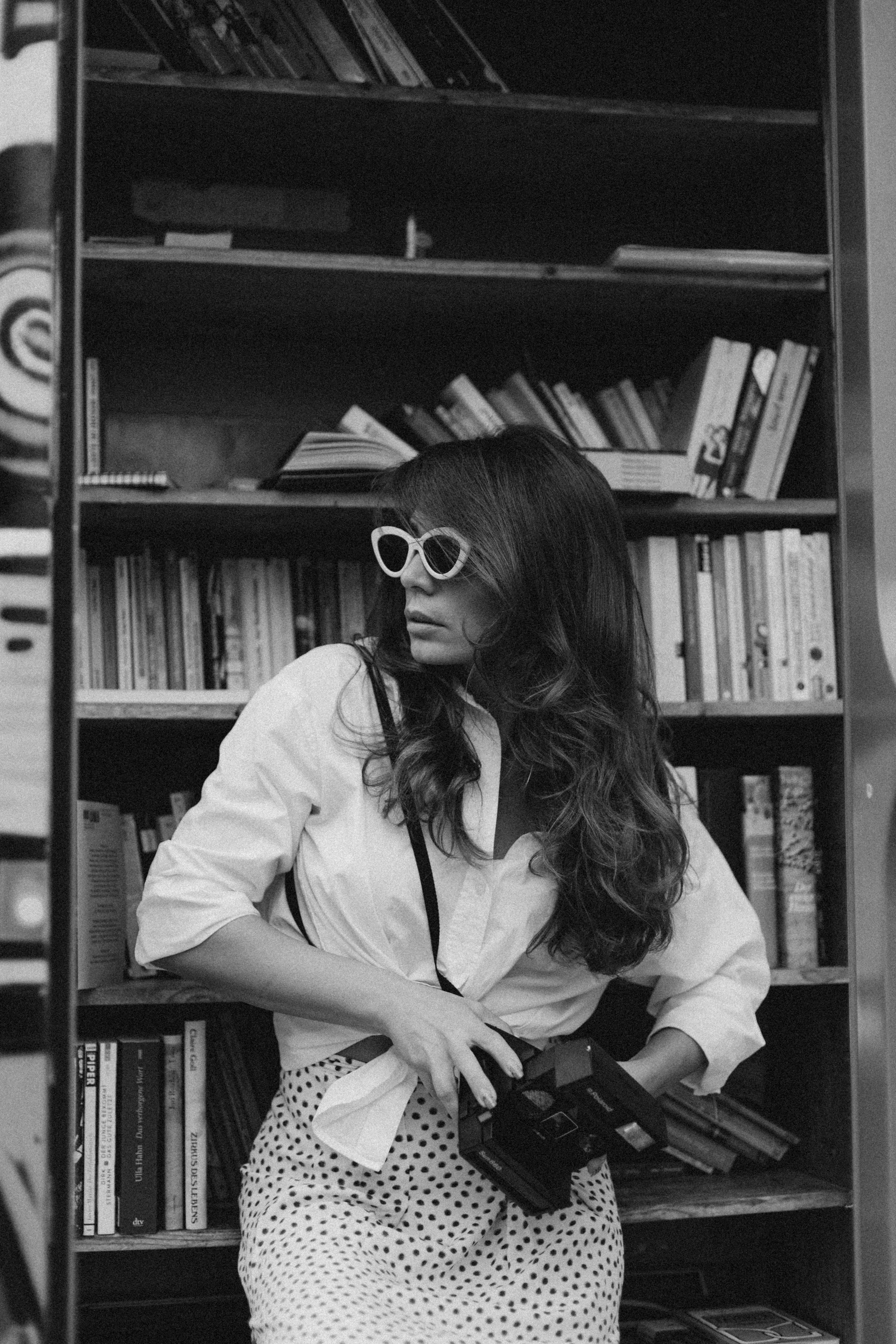 Vintage film still aesthetic with a figure in sunglasses in black and white